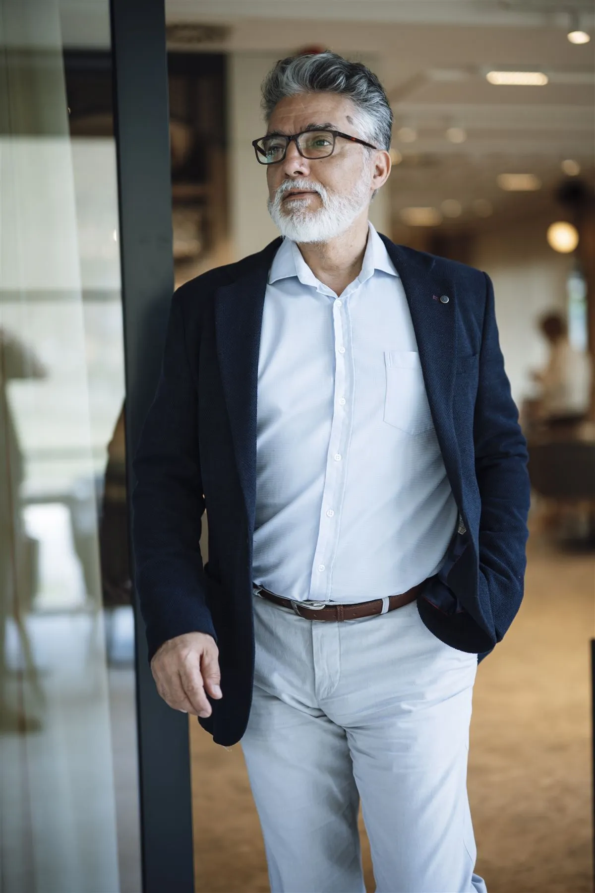 Confident business professional walking through a modern office